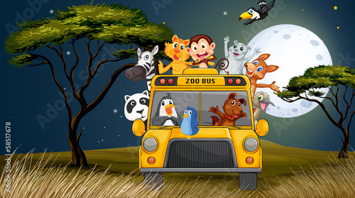 A bus near the trees full of animals