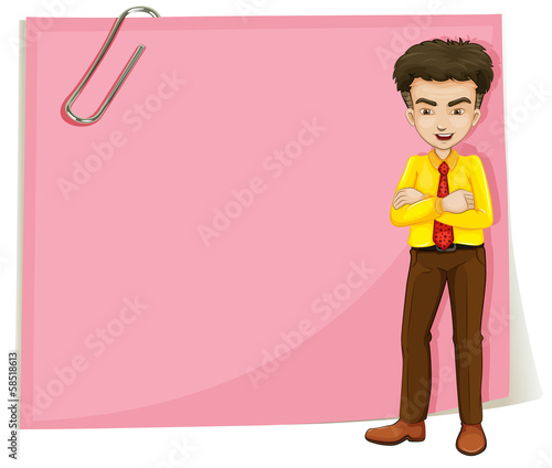 A man in front of a pink empty template with a paperclip
