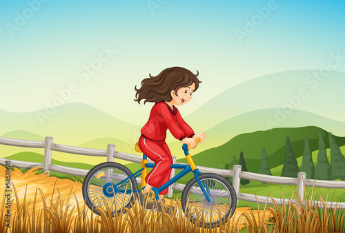 A girl biking at the farm