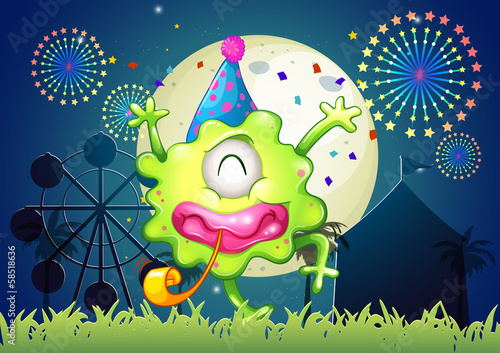 A happy one-eyed monster at the carnival with a firework display