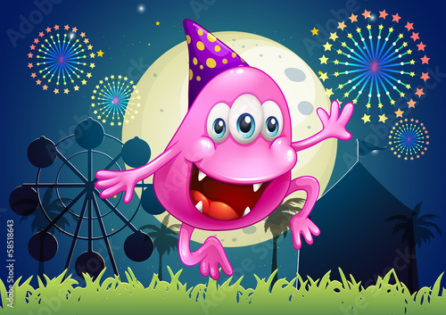 A happy pink beanie monster at the carnival