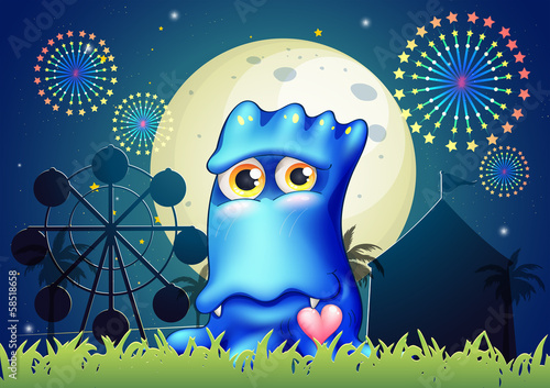 A blue monster near the grass at the carnival