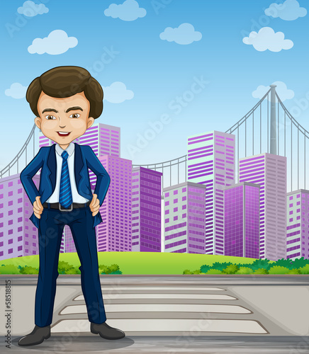 A handsome businessman standing at the pedestrian lane