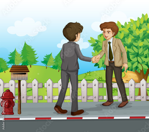 Two businessmen handshaking at the street