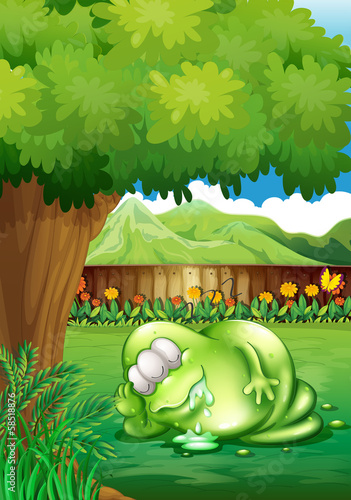 A fat monster sleeping under the tree at the yard