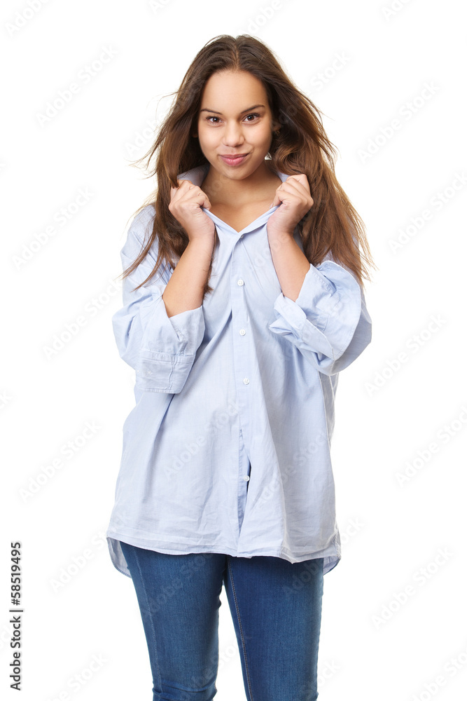 Young woman with long hair grinning and holding shirt Young woman with long hair grinning and holding shirt