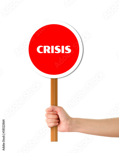Hand holding crisis red sign