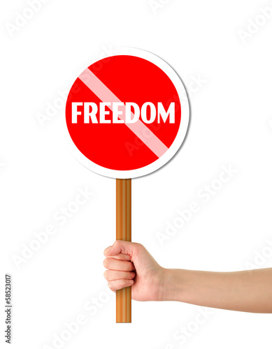 Hand holding freedom red sign
