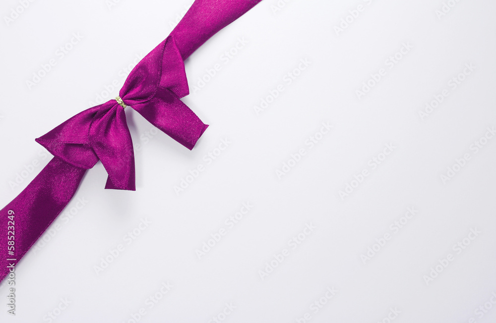 purple ribbon with bow with tails isolated on white background purple ribbon with bow with tails isolated on white background