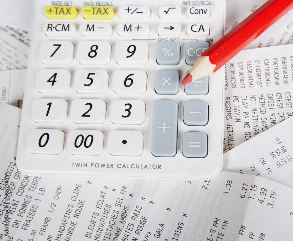 Calculator and bills. Stock Photo | Adobe Stock