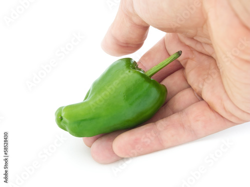 hand holding green pepper with clipping path