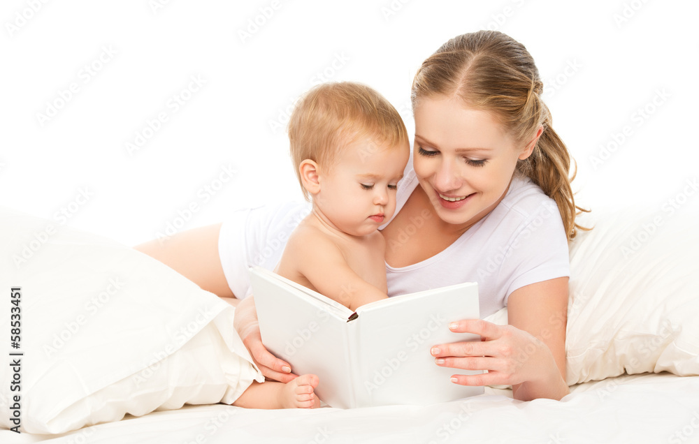 Mother reading book baby in bed before going to sleep Mother reading book baby in bed before going to sleep