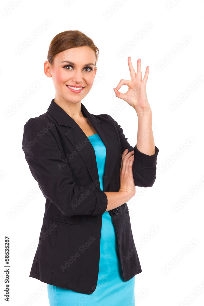 Smiling businesswoman showing OK sign. Smiling businesswoman showing OK sign.