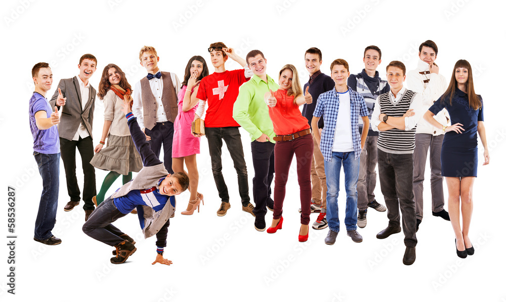 Fototapeta premium Large group of happy multicolored dressed teenagers on the white