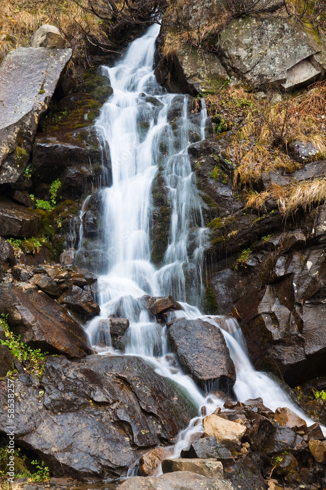 Fototapeta premium Beautiful autumn waterfall