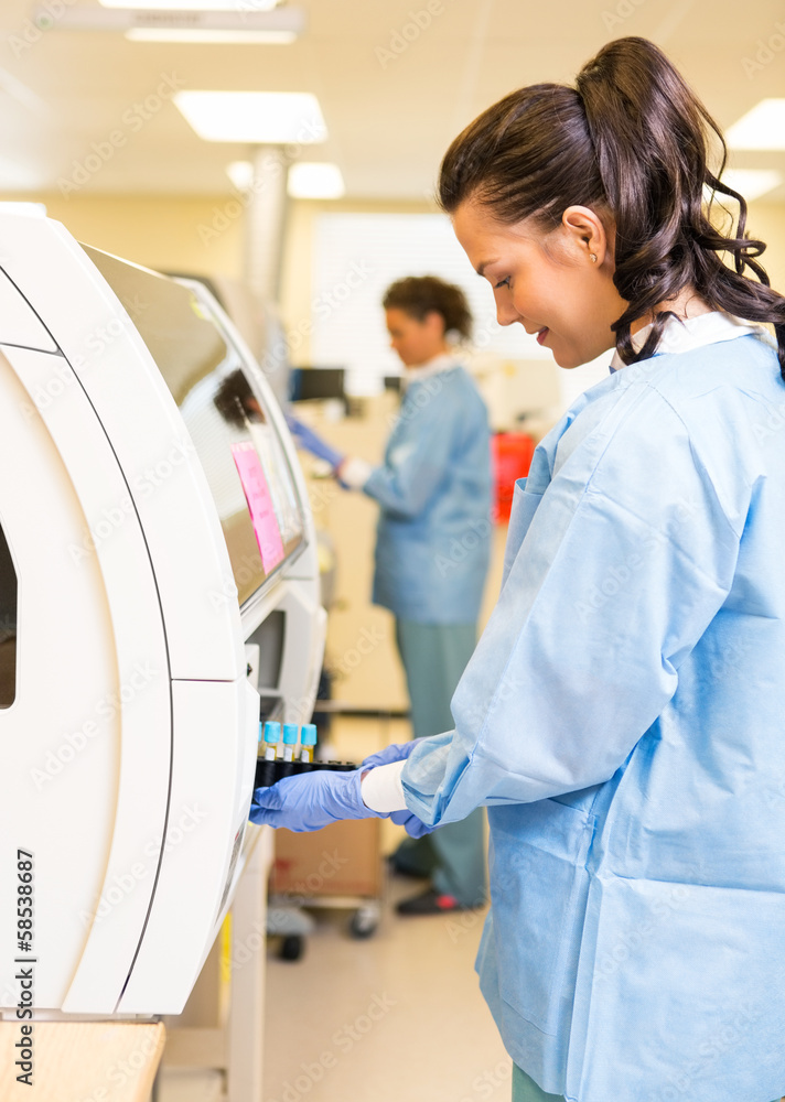 Medical Lab Tech Loading Coagulation Test Medical Lab Tech Loading Coagulation Test