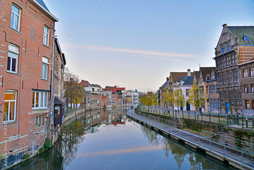 Old houses with canal of Mechelen at sunset. Belgium.