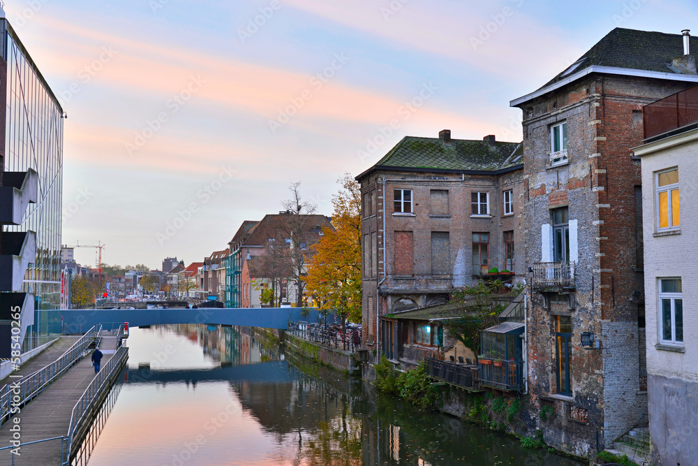 Old houses with canal of Mechelen at sunset. Belgium.