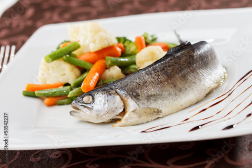 trout served with mixed vegetables