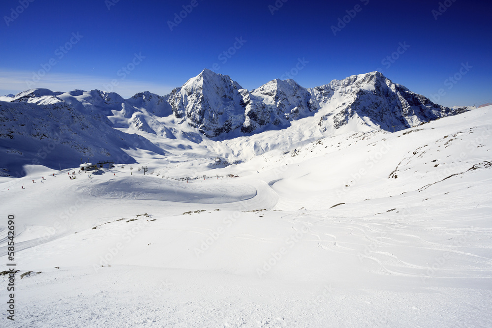 Winter mountains - ski slopes in Italian Alps