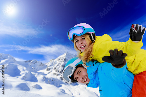 Skiing, winter sports, couple having fun on ski