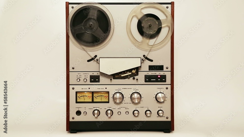 old reel tape recorder with spinning reels