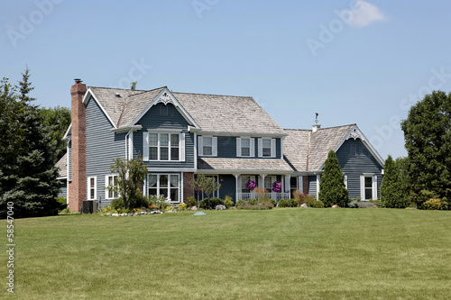 Suburban home with blue siding © pics721