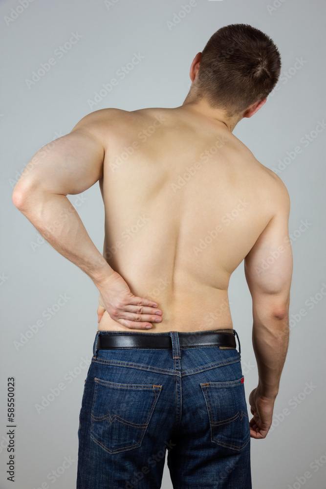 Young man with back pain