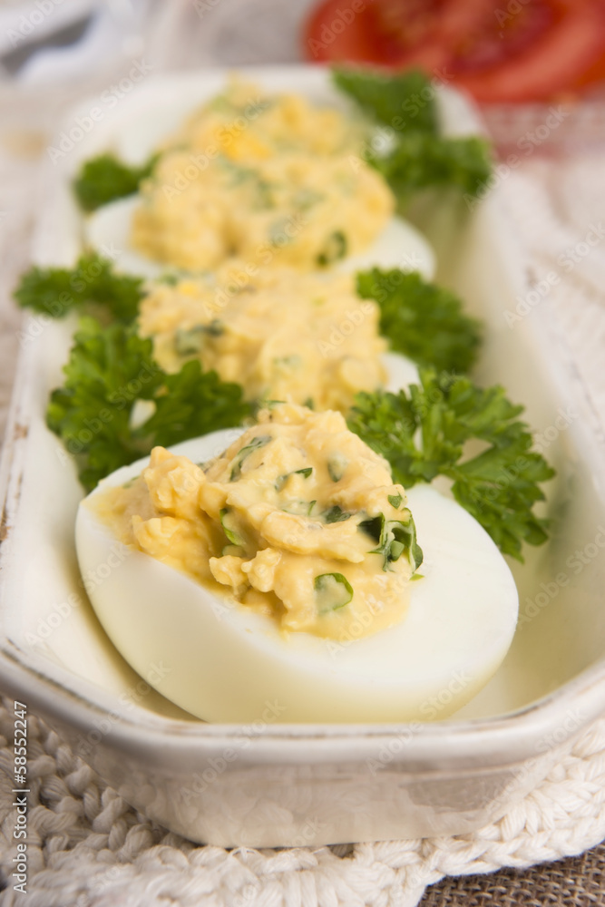 Stuffed eggs with parsley and mayonnaise