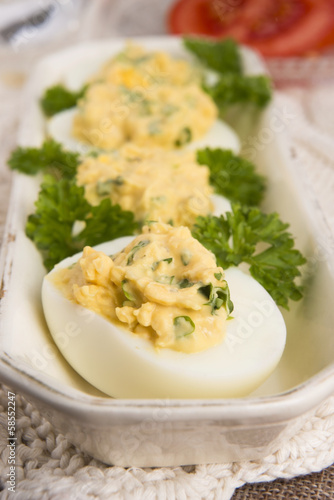 Stuffed eggs with parsley and mayonnaise