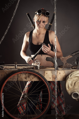 dirty woman threatening holding a hammer in hand