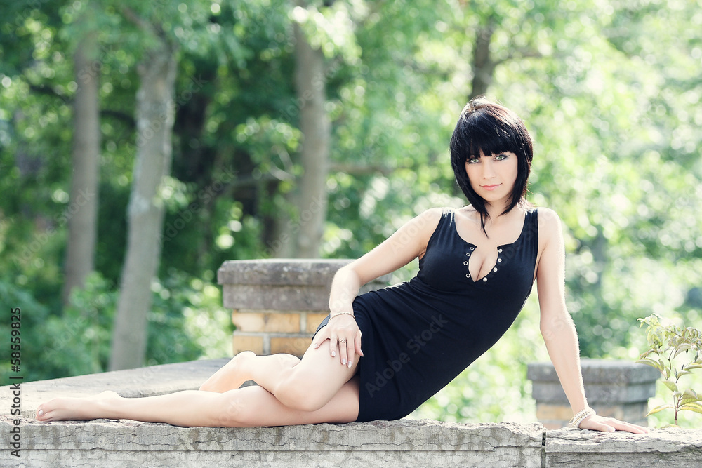 beautiful sexy woman in a black skin-tight dress Stock Photo | Adobe Stock