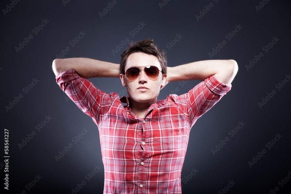 Young man with sunglasses relaxing Young man with sunglasses relaxing