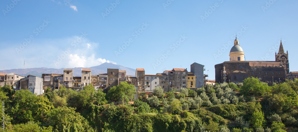 Typical village in Sicily with Etna volcano in the background