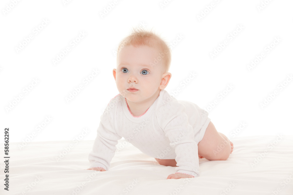 Cute baby with beautiful blue eyes on the white bed Cute baby with beautiful blue eyes on the white bed