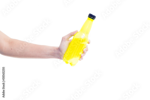 Close-up Of Hand Holding Plastic Bottle On White