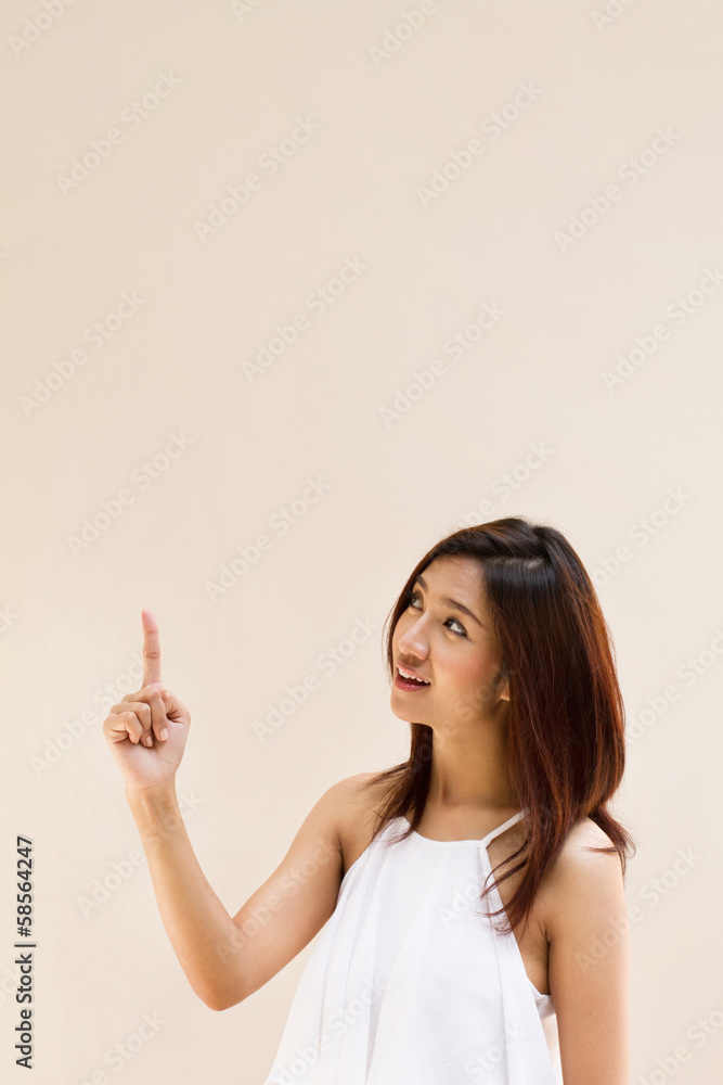 beautiful smiling happy positive woman pointing upward beautiful smiling happy positive woman pointing upward