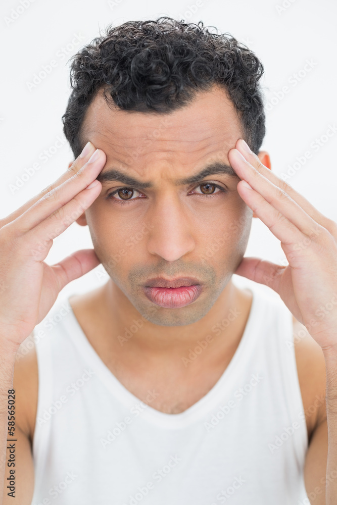 Close-up portrait of a man suffering from headache Close-up portrait of a man suffering from headache