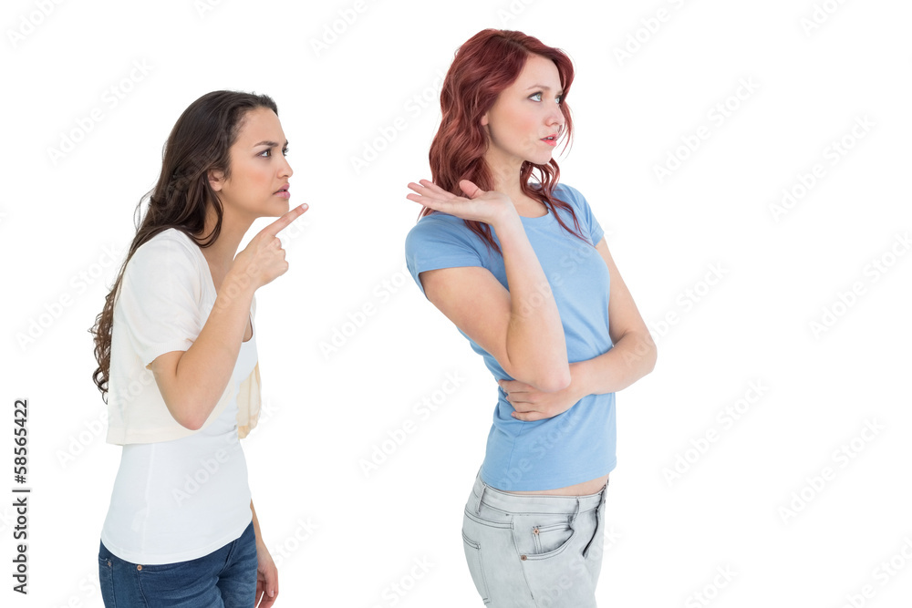 Angry young female friends having an argument Angry young female friends having an argument