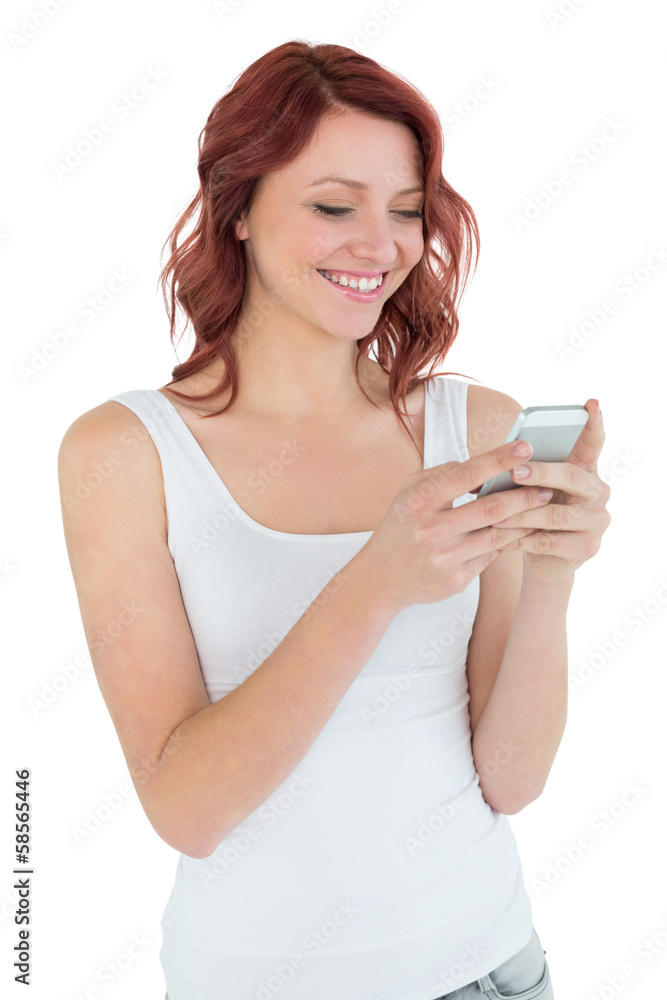 Smiling casual young woman text messaging Smiling casual young woman text messaging