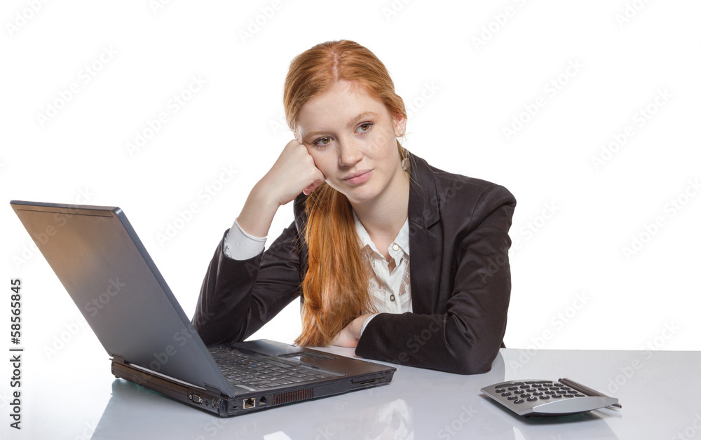 Young businesswoman sitting in front of her notebook Young businesswoman sitting in front of her notebook