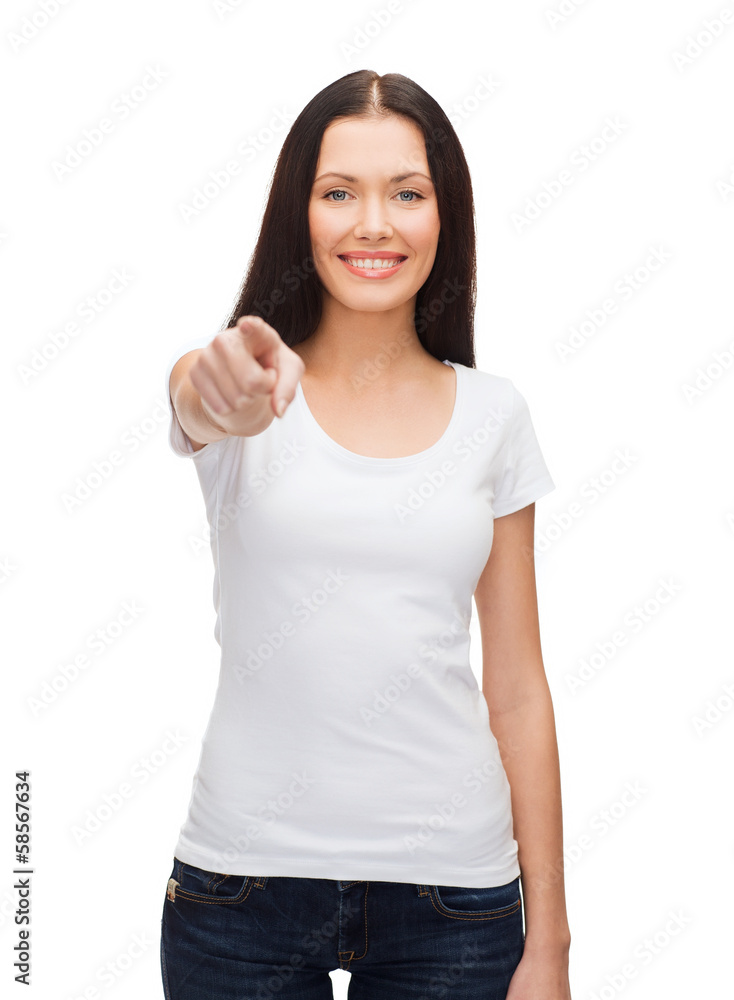 happy woman in blank white t-shirt pointing at you happy woman in blank white t-shirt pointing at you
