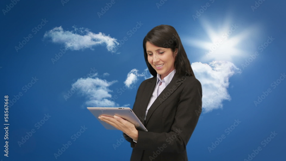 Attractive young businesswoman using her tablet Attractive young businesswoman using her tablet