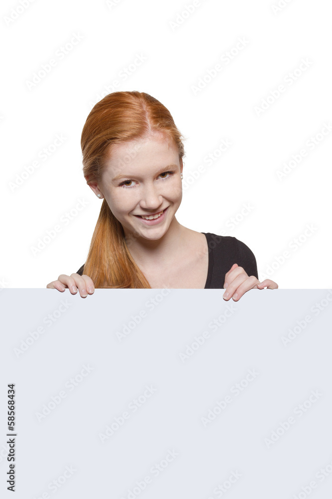 Teen girl holding a sign with copyspace for adverts Teen girl holding a sign with copyspace for adverts