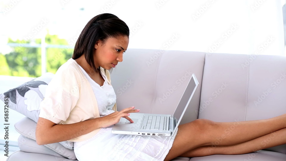 Young dark haired woman working with her laptop Young dark haired woman working with her laptop
