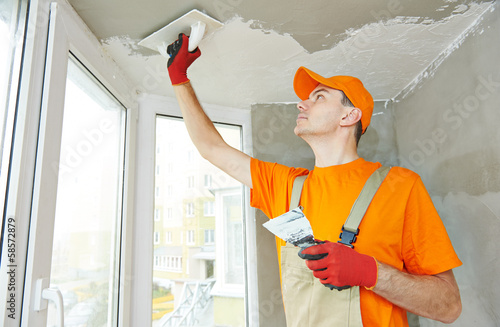 Obraz na płótnie Plasterer at indoor ceiling work