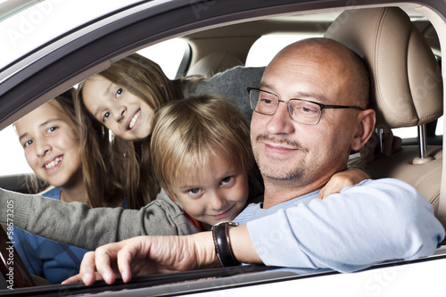 huppy father with children in a car © Jelena Gorlats
