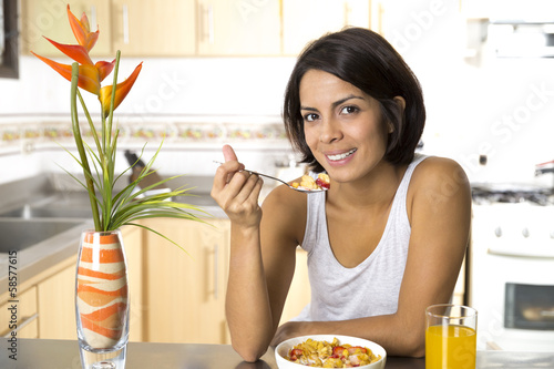 Attractive woman having breakfast