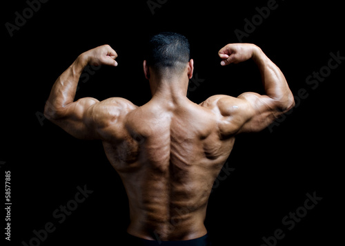 Leinwand Poster Back, shoulders and arms of muscular bodybuilder