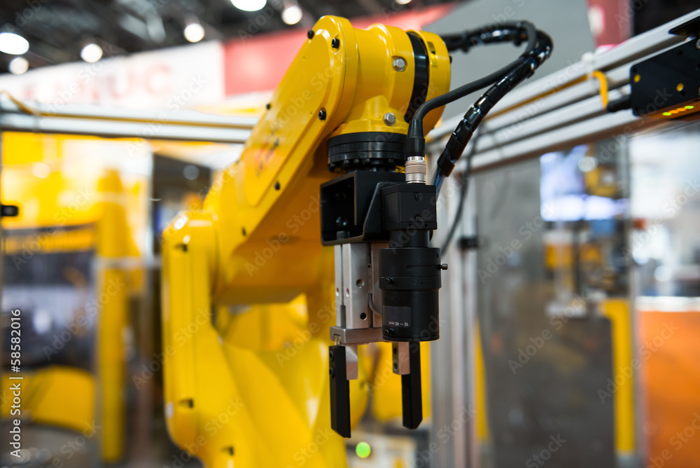 Fotografie Robot arm in a factory